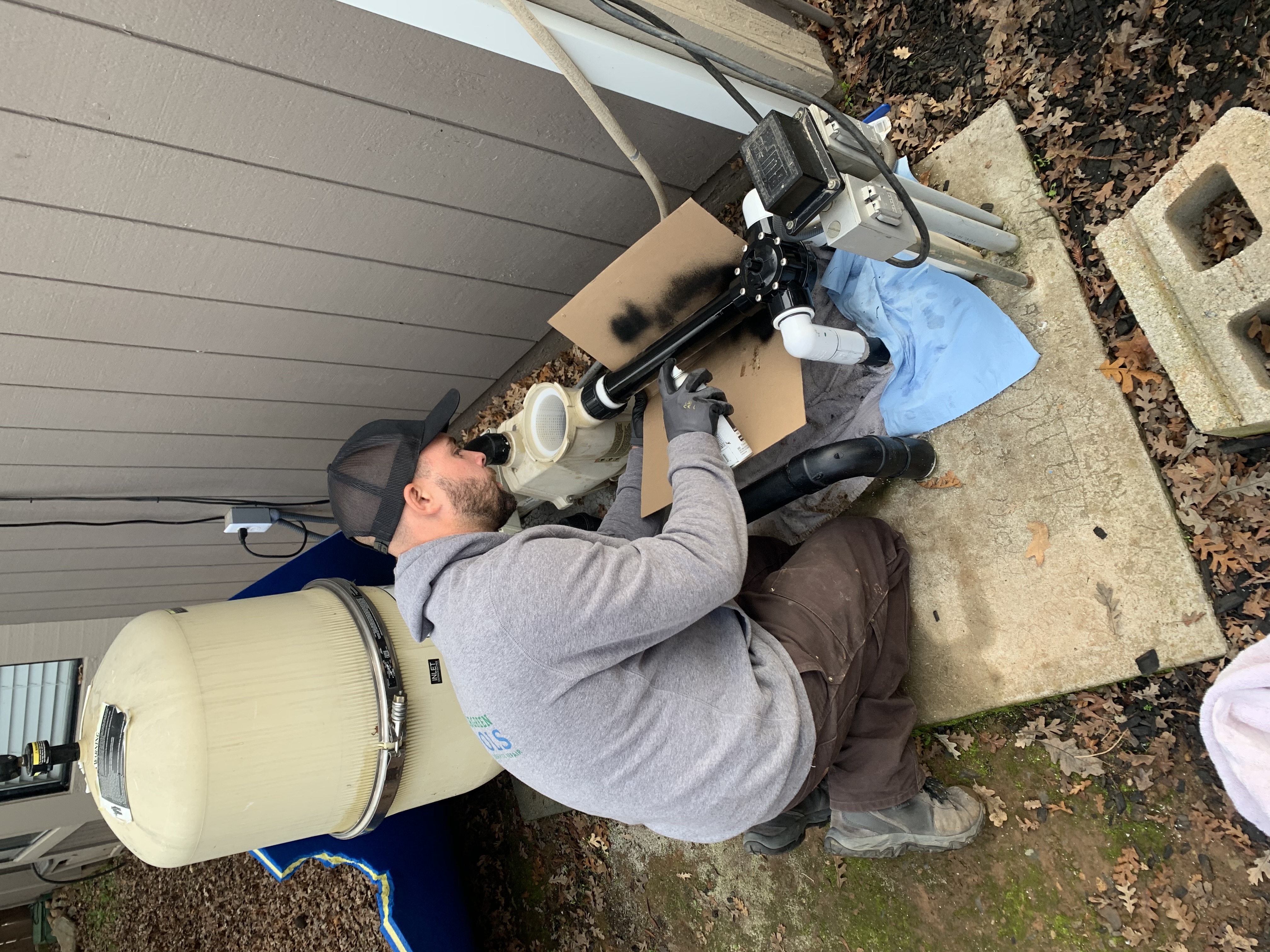 Pool Ninja technician brushing a clean residential pool